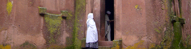 priest and believer bet giyorgis_lalibela